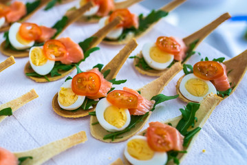 Delicates, appetizer filling with red fish and greens. Catring service.