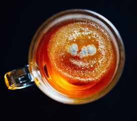 tea mold in a cup, black background
