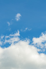 The vertical view of light blue sky with white clouds for background or texture. Copy space