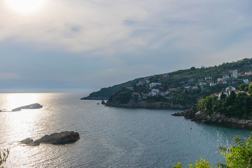 Fototapeta premium The picturesque city is located on the coastal slope of the mountain.