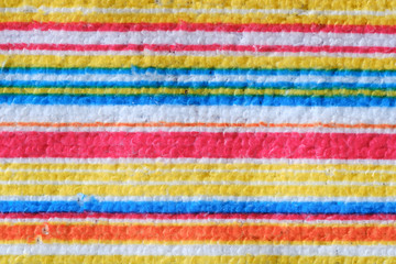 Striped beach towel useful as a background pattern