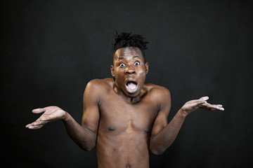 Obraz premium emotions black young man on a black background