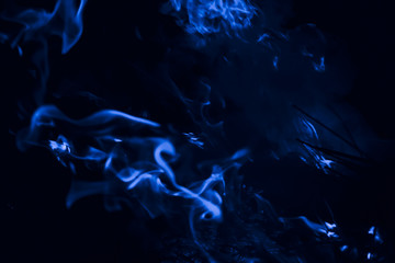 Blue flame. Fire. Burning of rice straw at night.