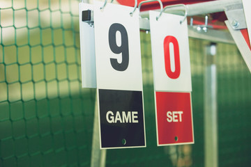 Scoreboard on tennis court during the game outdoor, closeup. Sports background