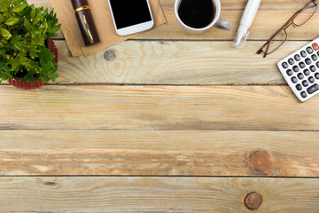 Office desk table with computer, pen and a cup of coffee, lot of things. Top view with copy space.