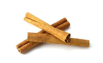 Top view of cinnamon sticks isolated on white.
