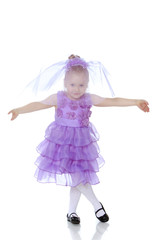 Little girl in purple dress.