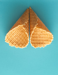 Empty waffle cup on blue backfround.
