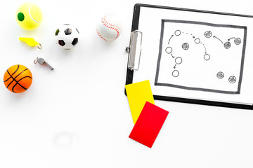 Sport judging concept. Basketball referee. Tactic plan for game, football ball, red and yellow cards, whistle on white background top view copy space