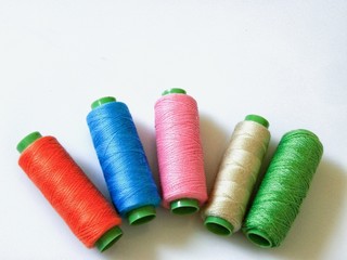 Colourful cotton yarns on rolls for sewing