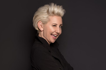 Elegant blonde beautiful middle aged lady posing .