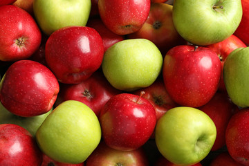 Fresh red and green apples as background
