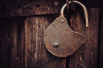 Vintage open Old Lock on the grunge Door