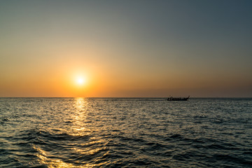 sunset at sea with a boat