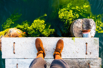 Green moss builds up on a stone jetty