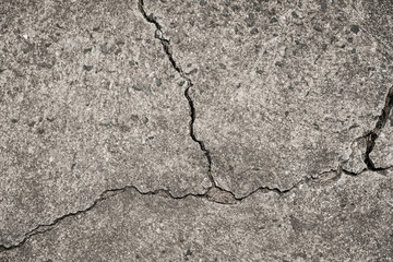 Obraz premium cracked concrete floor - crack in wall - broken stone texture