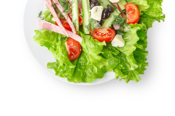 Fresh vegetable salad in a plate. Restaurant serving. Isolated.