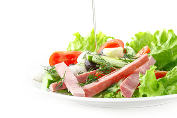 Fresh vegetable salad in a plate. Restaurant serving. Isolated.