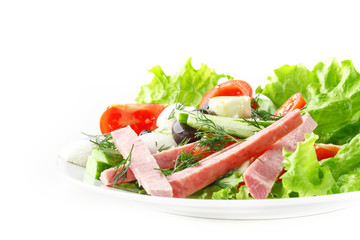 Fresh vegetable salad in a plate. Restaurant serving. Isolated.