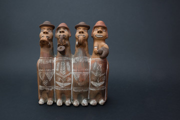 Old typical Peruvian sculpture made in terracotta on a dark background - 1980s
