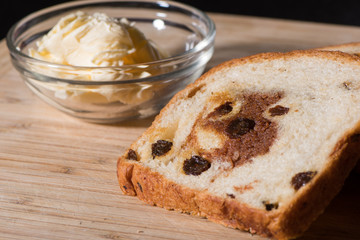 Cinnamon raisin toast with dish of butter