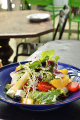 Fresh fruit salad in a blue plate   