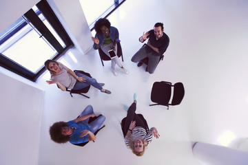 Multiethnic startup business team on meeting  top view