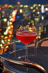 Cocktail glasses with city view.        