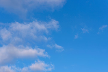 Fototapeta premium Bright blue sky with some clouds - for background, copyspace