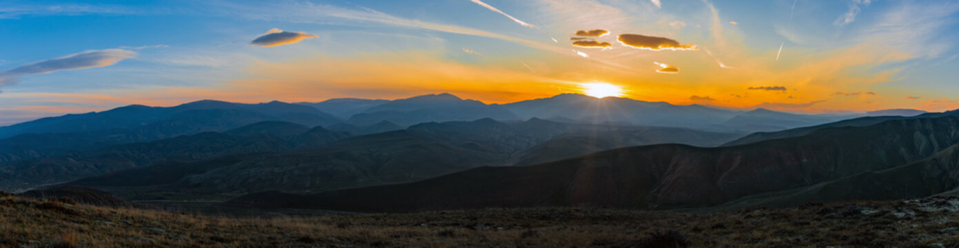 Colorful bright sunset in the mountains, panoramic photo © Vastram