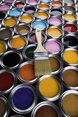 Colorful paint cans with paintbrush
