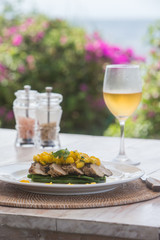 Fish fillet barramundi with mango and white wine