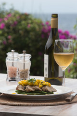 Fish fillet barramundi with mango and white wine