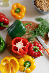 Raw colorful peppers stuffed  with chopped meat and rise