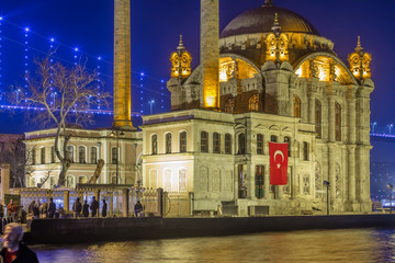 Fototapeta na wymiar Exterior view of Ortakoy Mosque with15 July Martyrs Bridge