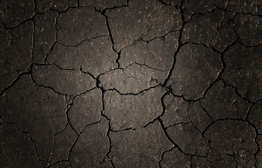 Black cracked ground for designers background