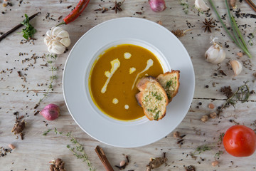 Pumpkin and carrot soup with bread