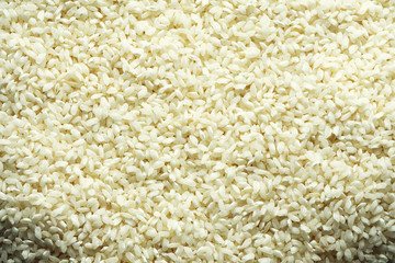 White raw organic basmati rice background. Food ingredient background. Top view, healthy lifestyle concept.