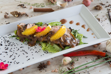 Roasted duck breast with oranges and orange sauce