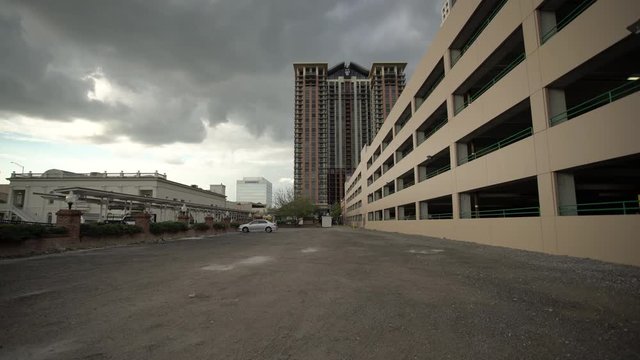 The 55 West Apartments tower on a cloudy day