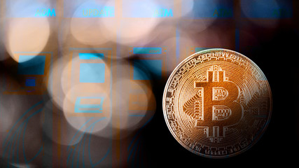 Golden bitcoin coin symbol of bitcoin crytocurrency from blockchain technology with background of autometic teller machine or atm