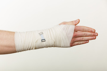 Male hand in bandage.