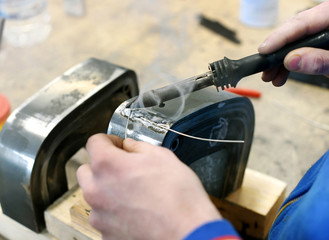 Soldering metal elements in workshop
