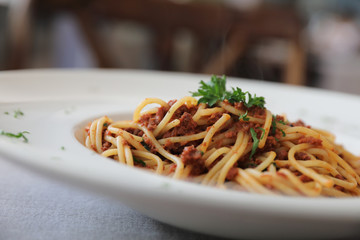 Spaghetti bolognese with beef tometo sauce on wood table , italian food