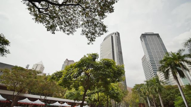 Gardens and skyscrapers seen at Ayala Triangle Park, in Makati, Metro Manila.
