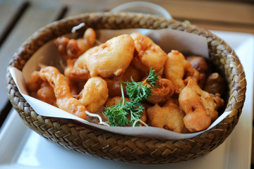 Calamari rings , fried squid on wood background , Italian food