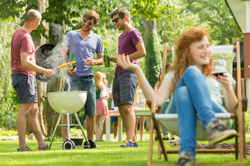 Young men grilling