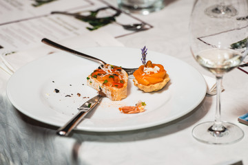 Served table for food and wine tasting. Snacks with shrimp, fish fillets, Spain tapas recipe food pintxos