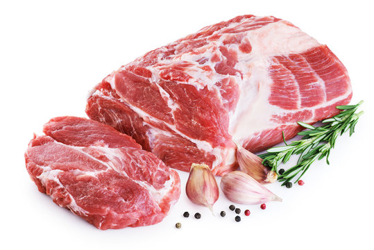 Fresh raw pork neck meat, garlic, pepper and rosemary isolated on white background.