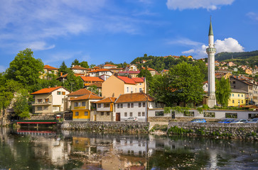 Fototapeta na wymiar View of old town against cloudy sky in Sarajevo 